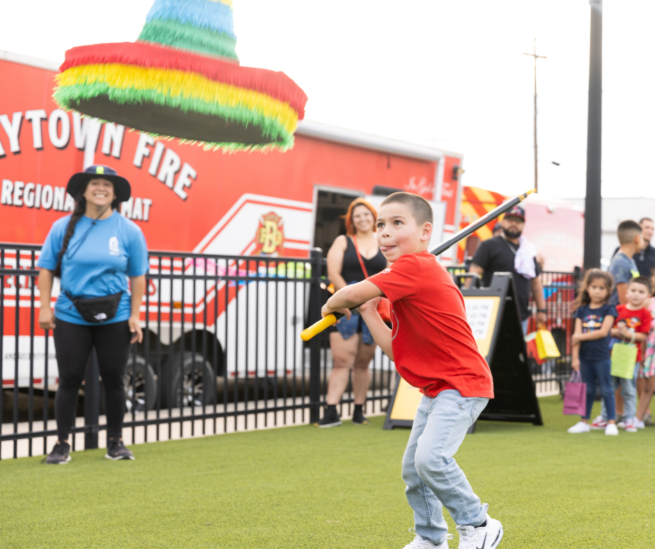 Child hitting a piñata 