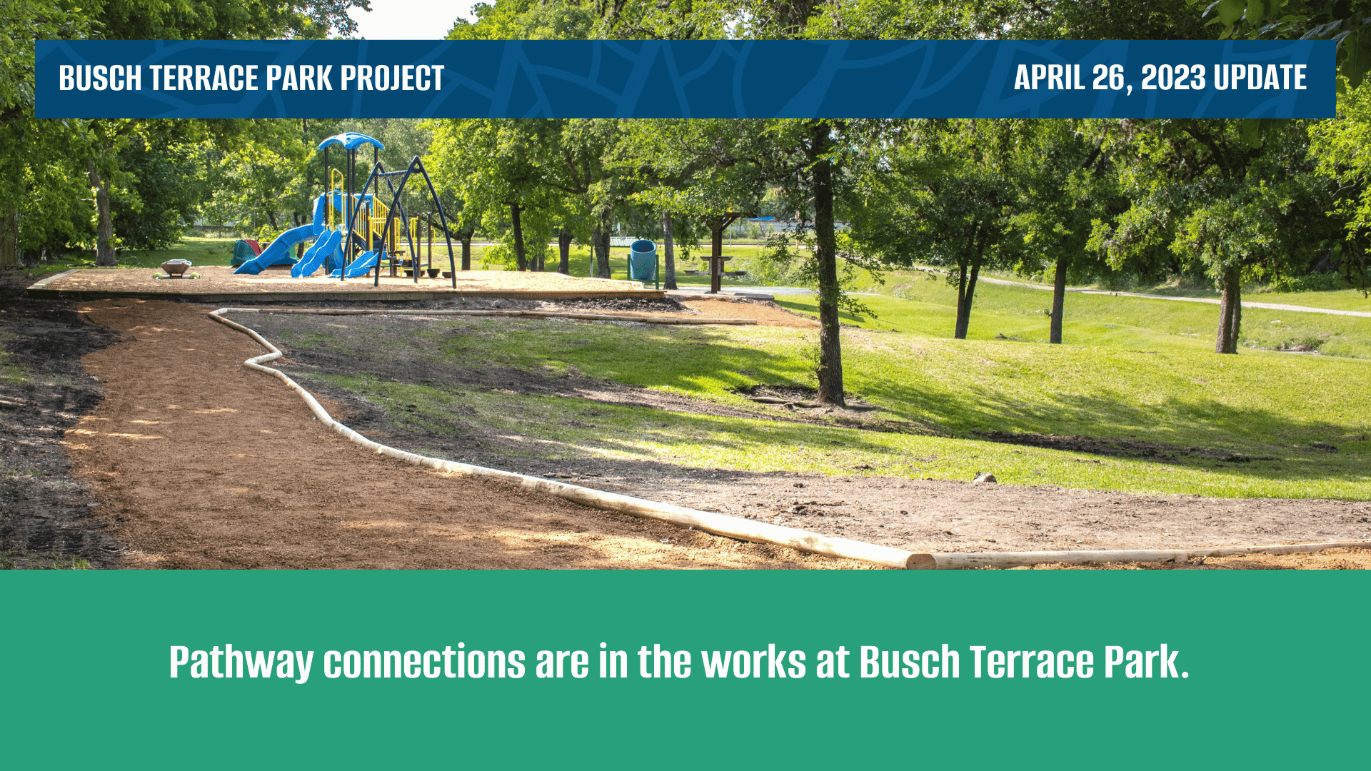 Dirt pathway under construction leading to a playground and picnic shelter
